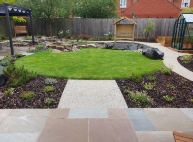 Kate Charles Garden Design - Completed Garden, with circular lawn taking centre stage