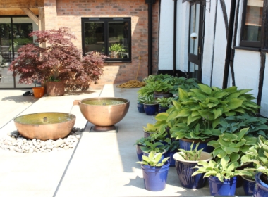 A shady area next to the house was perfect for copper bowls and a display of the client’s Hosta collection Kate Charles Garden Design - A shady area next to the house was perfect for copper bowls and a display of the client’s Hosta collection