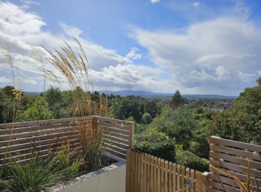 Kate Charles Garden Design - Grasses frame the view of the Malvern Hills
